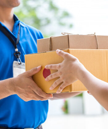 Optimized-woman-hand-accepting-delivery-boxes-from-deliveryman_41350-152